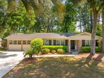 Charming single-story home with well-maintained landscaping and a two-car garage at 620 Clearview Dr, Charleston, SC 29412