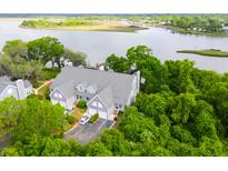 Stunning waterfront townhome with lush greenery, private parking, and serene water views at 112 Waterfront Plantation Dr, Charleston, SC 29412