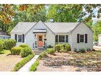 Charming painted brick home featuring a walkway to the front door and manicured landscaping at 4503 Overbrook Ave, North Charleston, SC 29405