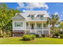 Charming two-story home features a welcoming front porch, well-manicured lawn, and mature landscaping at 112 Berkshire Dr, Wando, SC 29492