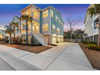 Charming beach house with a spacious driveway and three stories of porches and decks at 2924 Tranquility Rd, Mount Pleasant, SC 29466