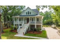 Charming two-story home with a welcoming front porch and well-maintained landscaping at 3635 Pandora Dr, Mount Pleasant, SC 29466