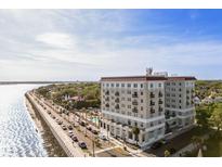 Stunning aerial view of a beautiful waterfront property with palm trees and a pool in a desirable coastal location at 1 King St # 501, Charleston, SC 29401