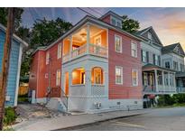 Charming two-story home with a welcoming porch and fresh exterior paint at 15 Dewey St, Charleston, SC 29403