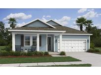 Charming single-story home with blue siding, a two-car garage, covered porch, and well-manicured lawn at 2034 Mcguire Ln # 009, Hollywood, SC 29449