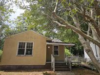 Charming single-story home with a covered front porch and handicap ramp at 2313 Aintree Ave, North Charleston, SC 29405