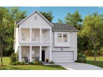 Charming two-story home with white siding, a double porch, and an attached garage at 538 Richfield Way, Summerville, SC 29486