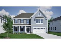 Charming two-story home with a modern color palette, black shutters, and a two-car garage on a sunny day at 142 Seaton St, Summerville, SC 29486