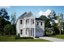 Charming two-story home with a light-green exterior, white trim, and well-manicured front lawn at 216 Yalton St, Summerville, SC 29486