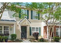 Charming two-story townhome with traditional architecture, green shutters and a well maintained lawn at 224 Jackson St, Goose Creek, SC 29445