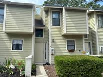 Inviting townhouse with unique architecture, light green siding, and well-maintained landscaping at 2314 Treescape Dr # 2406, Charleston, SC 29414