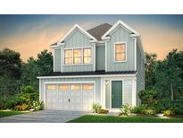 Charming two-story home with blue siding, a garage, and a well-manicured lawn at 4008 Flatiron Dr, Charleston, SC 29414