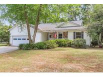 Charming single-Gathering home featuring a two-car garage, brick accents, and a well-maintained front yard at 7 Sconesill Ln, Charleston, SC 29414