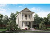 Charming two-story home features a double porch and beautifully landscaped front yard at 712 Rumbling Leaf Ln, Summerville, SC 29486