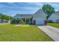 Charming single-story home featuring a well-manicured lawn and an attached one-car garage at 101 Old Tree Rd, Goose Creek, SC 29445
