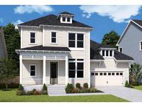 Charming two-story home with a well-manicured lawn, attached garage, and classic architectural details at 1159 Reserve Ln, Awendaw, SC 29429
