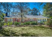 Charming brick home with mature landscaping, offering a classic and inviting curb appeal at 210 Padgett Loop, Walterboro, SC 29488