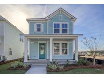 Charming two-story home with a welcoming front porch and a light blue exterior at 213 Clearpath Dr, Summerville, SC 29486