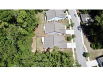 An aerial view of houses with trees and a road at 3997 Aspera Dr, Summerville, SC 29483