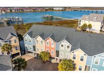 Beautiful multi-colored townhouse exteriors with modern architectural details and harbor views at 81 Sandbar Ln # 19, Folly Beach, SC 29439