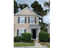Charming two-story townhome with black shutters and a cozy entrance at 9010 Maple Grove Dr, Summerville, SC 29485