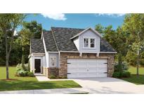 Charming two-story home with stone accents, a gray roof and a two car garage at 1013 Sagegrass St, Summerville, SC 29485