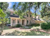 Exterior view of home with covered porch and lush landscaping at 3 Birmingham Ct, Charleston, SC 29407