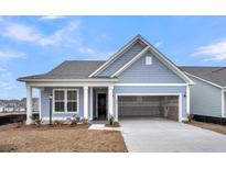 Charming single-Gathering home with a two-car garage and blue siding, under a clear, sunny sky at 321 Abercom Place Dr, Moncks Corner, SC 29461