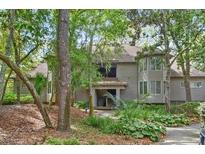 Charming home nestled among mature trees and lush landscaping, creating a tranquil setting at 4856 Green Dolphin Way # Share 7, Kiawah Island, SC 29455