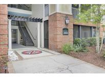 Building 2000 entrance with brick facade, decorative compass inlay, and stairs to upper floors at 2014 Basildon Rd, Mount Pleasant, SC 29466