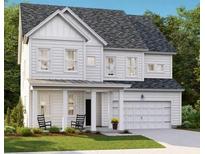 Charming two-story home with a covered porch and well-maintained front yard at 533 Verdi Dr, Summerville, SC 29486