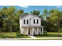 Charming two-story home with a welcoming front porch and well-maintained landscaping at 774 Clay Field Trl, Summerville, SC 29485