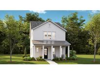 Charming two-story home featuring a cozy front porch with rocking chairs and well-manicured landscaping at 784 Clay Field Trl, Summerville, SC 29485