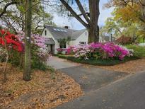 Charming home featuring a driveway lined with beautiful azaleas at 2169 Westrivers Rd, Charleston, SC 29412