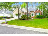 Charming single-Gathering home with a manicured lawn, mature trees, and inviting curb appeal at 2520 Woodstream Rd, Mount Pleasant, SC 29466