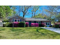 Charming brick home with colorful azalea bushes and a well-maintained lawn, perfect for curb appeal at 2636 Elissa Dr, Charleston, SC 29414