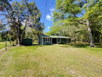 Charming single-story home with green lawn and mature trees creating a serene and inviting exterior at 1425 Risher Mountain Rd, Walterboro, SC 29488