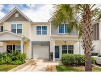 Charming townhome featuring a well-maintained front yard and a lovely palm tree at 151 Kirkland St, Goose Creek, SC 29445