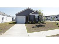 Charming single-Gathering home with a well-manicured lawn and a cozy front porch at 224 Coral Sunset Way, Summerville, SC 29486