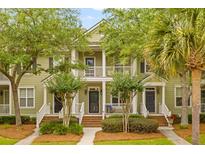 Charming townhomes with double front porches, landscaping, and mature trees, ideal for community living at 2948 Treadwell Street St, Mount Pleasant, SC 29466