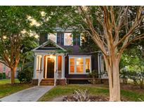 Charming two-story home with a well-maintained front yard and inviting front porch at 321 Bounty Ln, Charleston, SC 29412