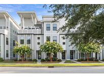 Charming townhomes with modern architectural details and beautifully landscaped front yards at 4557 Mixson Ave, North Charleston, SC 29405