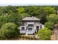 Stunning aerial view of a home, highlighting its private pool and lush surroundings near the Ravenel Bridge at 525 Old Bridge Ct, Mount Pleasant, SC 29464