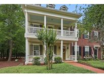 Charming two-story home featuring a double porch with white columns and shutters at 1787 Tennyson Row # 9, Mount Pleasant, SC 29466