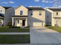 Charming two-story home boasts a well-manicured lawn and a two-car garage for modern comfort at 244 Tuscan Sun St, Summerville, SC 29485
