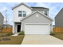 Charming two-story home featuring gray siding, a spacious garage, and a well-manicured front yard at 538 Pender Woods Dr, Summerville, SC 29486