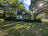 Charming home with mature trees and a cozy front porch at 1259 Wisteria Rd, Charleston, SC 29407