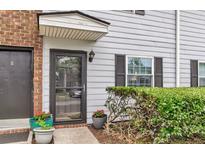 Charming front door with potted plants and fresh exterior paint welcomes you home at 21 Rivers Point Row # Apt 11 C, Charleston, SC 29412