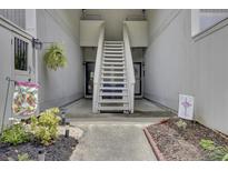 Charming condo entrance with stairs and walkway leading to the front door at 807 Greencastle Dr, Goose Creek, SC 29445