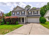Charming two-story home with a well-manicured lawn and inviting curb appeal at 1039 Steelechase Ln, Hanahan, SC 29410